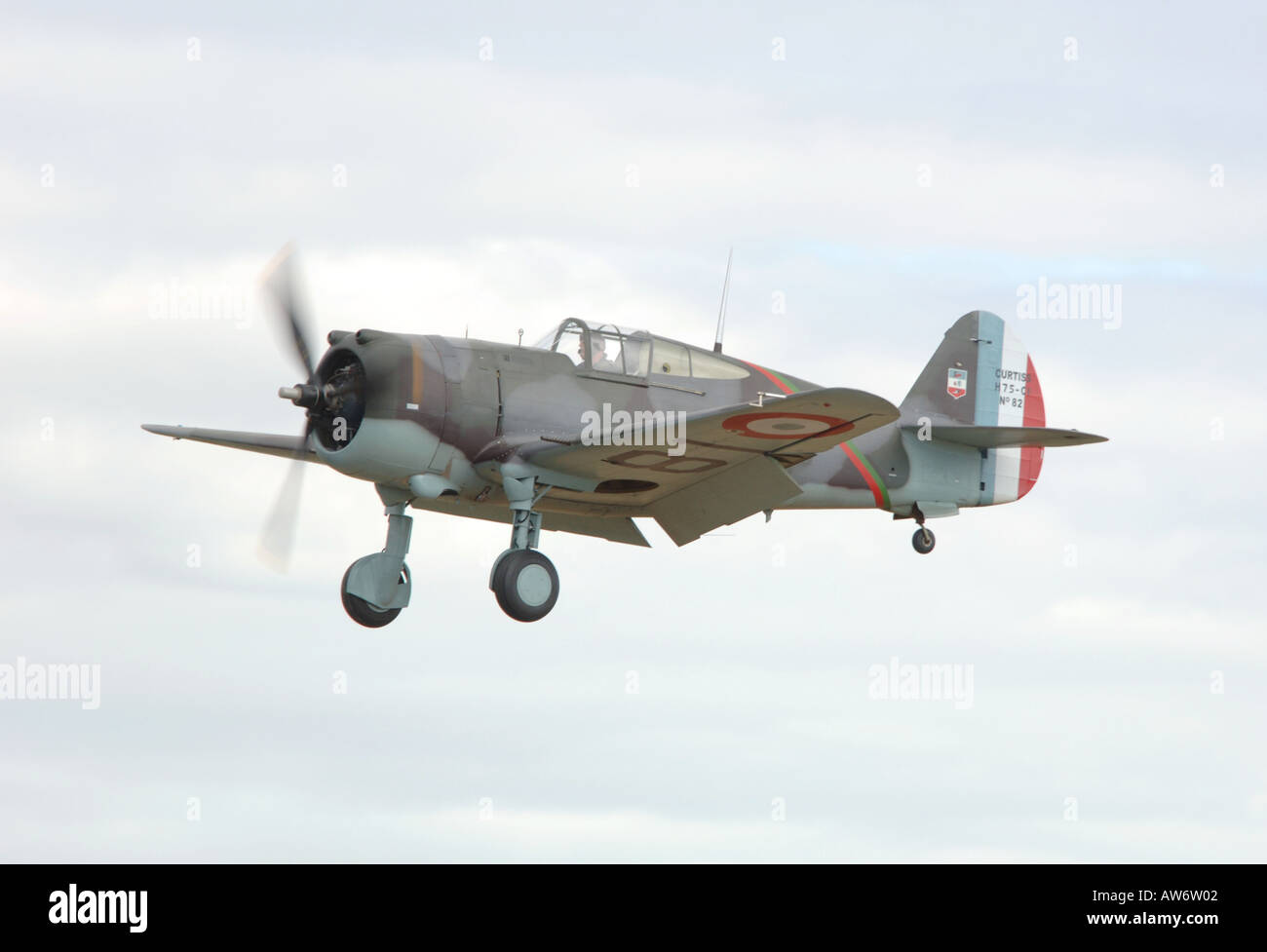 WWII Gruman Hellcat fighter plane gives a dogfight display at the Goodwood Revival Stock Photo