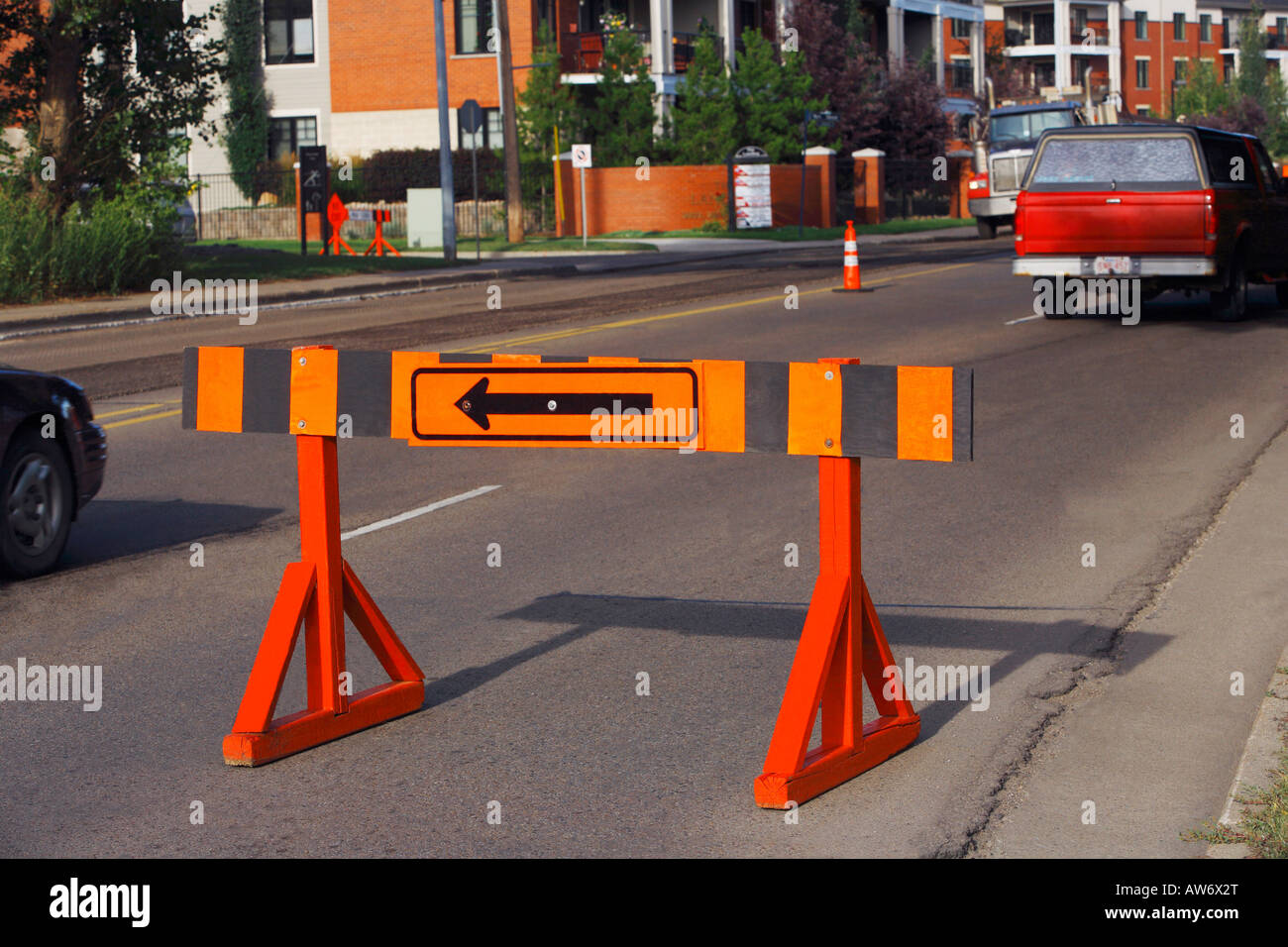 Barricade with a detour arrow on it Stock Photo