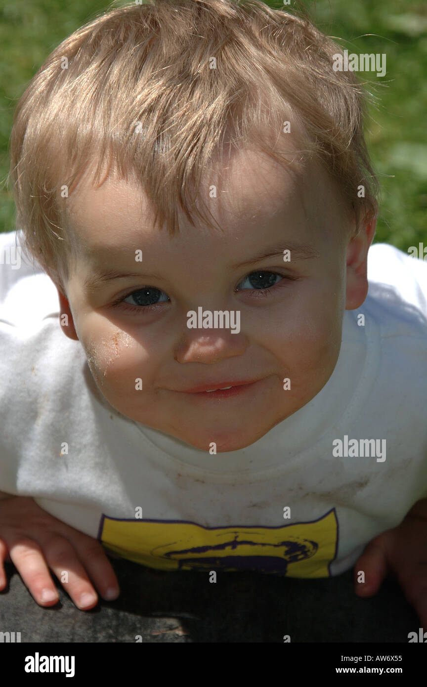 1 year old caucasian boy with blonde hair, looking up. Stock Photo