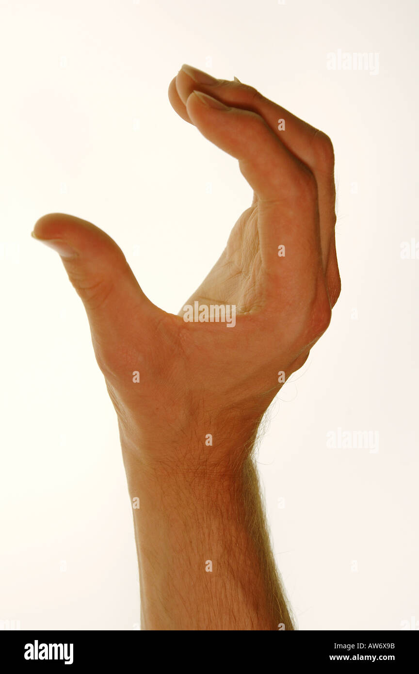 Young caucasian man's hands demonstrating the British sign for the letter C  against a white background Stock Photo