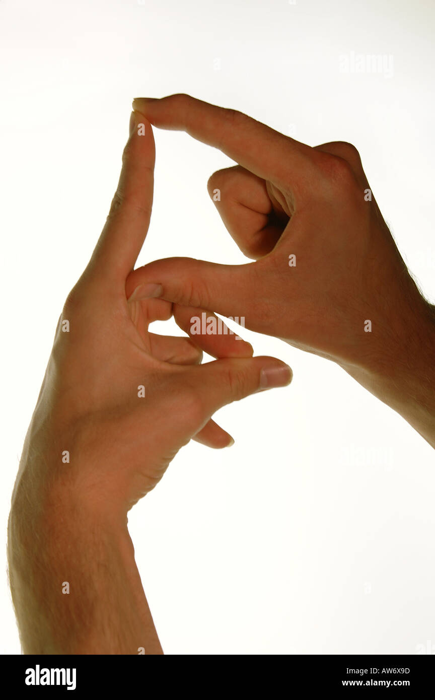Young caucasian man's hands demonstrating the British sign for the ...