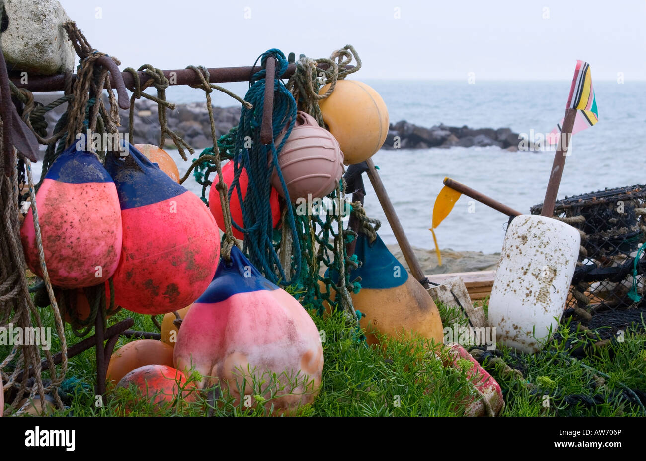 Colourful plastic fishing floats and nets hanging up at Steephill Cove