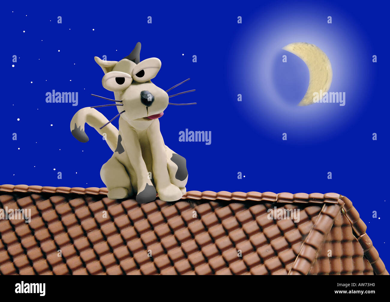 Dog on a roof in moonlit night Stock Photo