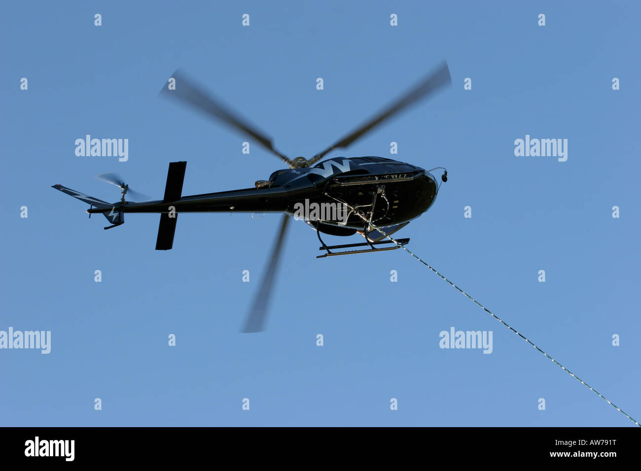 AS350 astar helicopter working flying eurocopter Stock Photo - Alamy