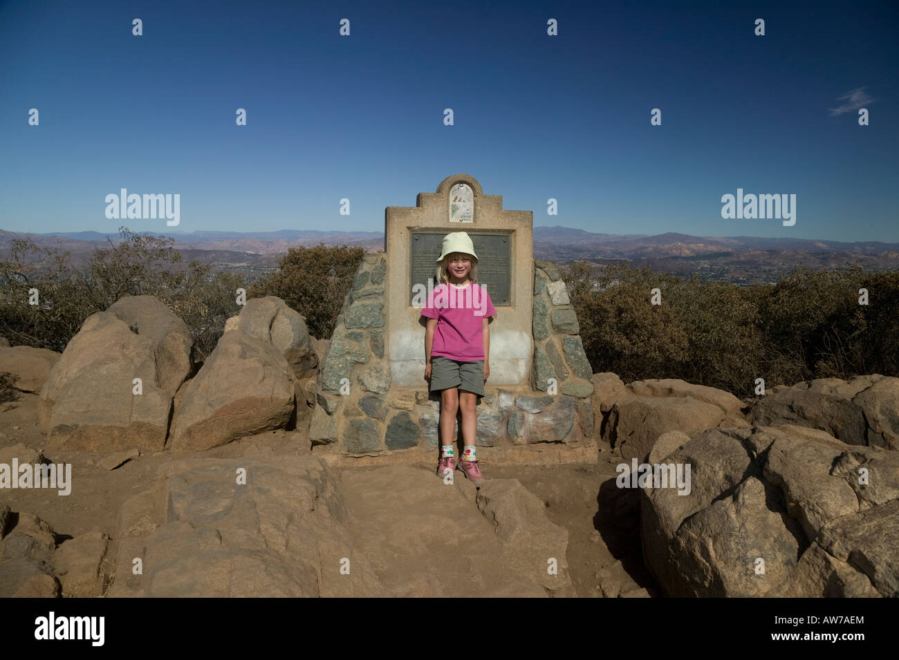 Girl by summit plaque Mission Trails Cowles Mountain San Diego, California, USA Stock Photo