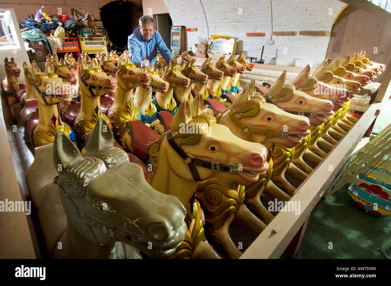 Fairground carousel horses in storage having winter repairs done out of season. Stock Photo