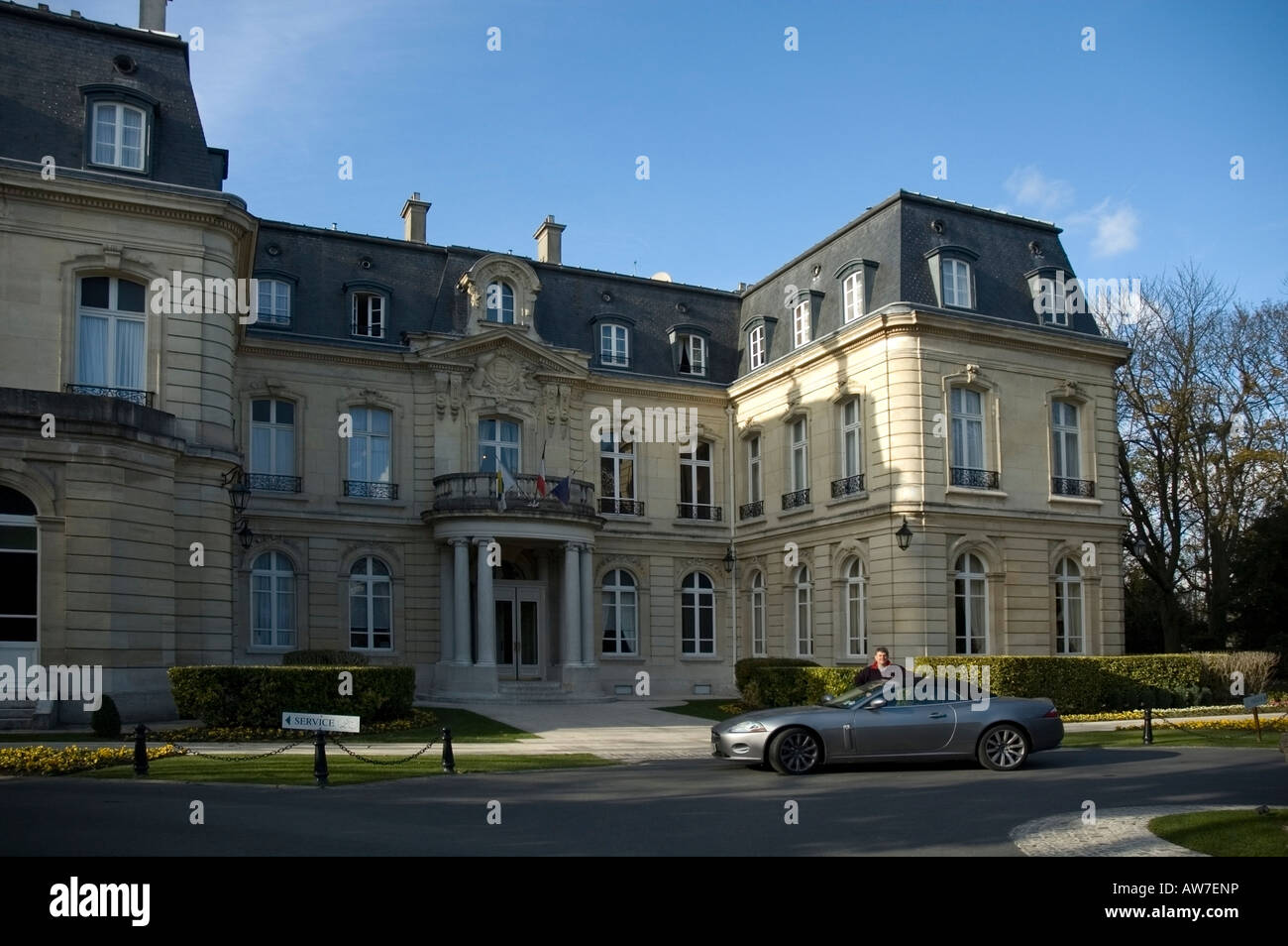 Front entrance to Chateau Les Crayers, jaguar XK convertible and the driver outside, Reims, Northern France, Europe, EU Stock Photo
