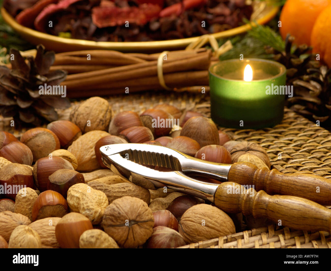 Filbert (Corylus maxima), English walnut (Juglans regia) and peanut (Arachis hypogaea) with nutcracker Stock Photo