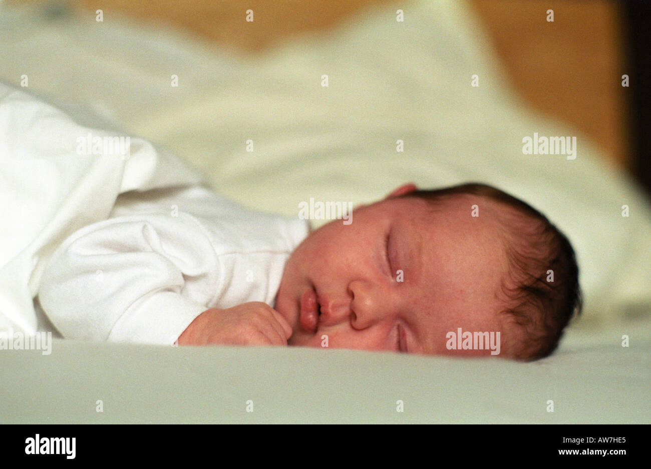 sleeping baby on soft sheets Stock Photo