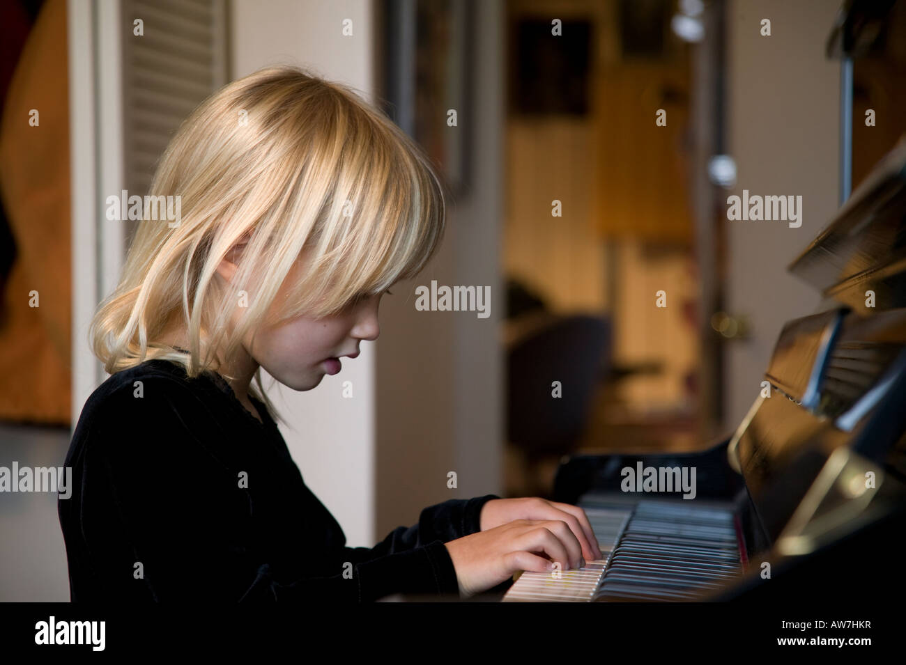 Girl playing piano Stock Photo