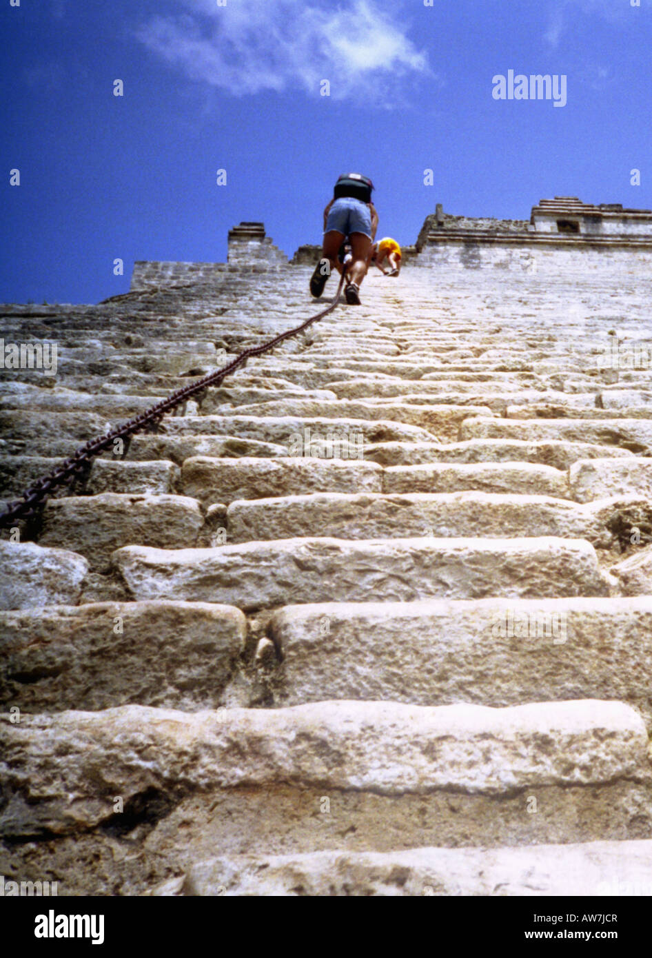 'Ascend to the sky' Steep climbing with iron chain to top of Maya stone pyramid Uxmal Yucatan Mexico Central Latin America Stock Photo