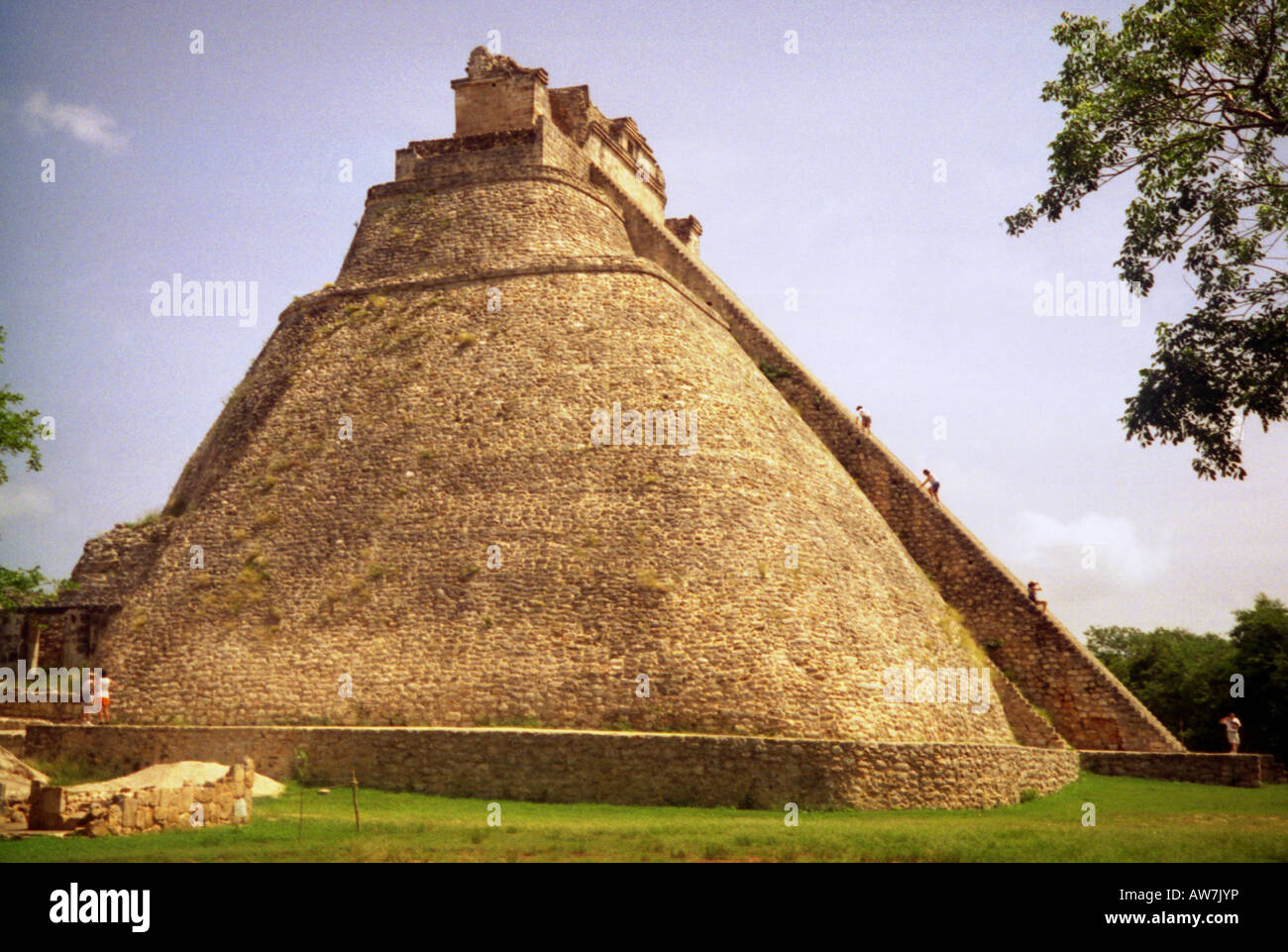 'Ascend to the sky 2' People climbing to top of big steep Maya stone pyramid Uxmal Yucatan Mexico Central Latin America Stock Photo