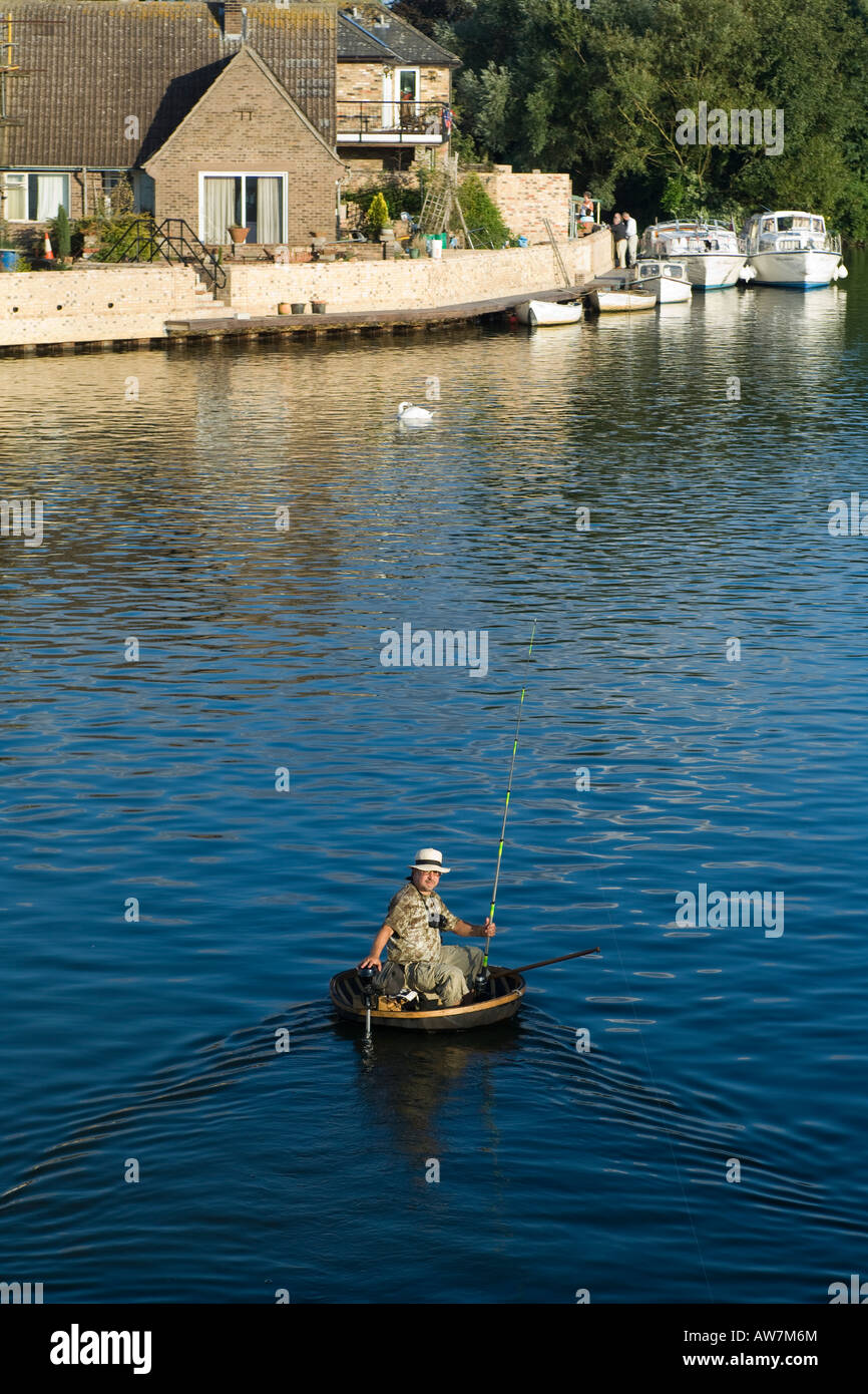 Fishing on the river Great Ouse from a modern Coracle Stock Photo - Alamy