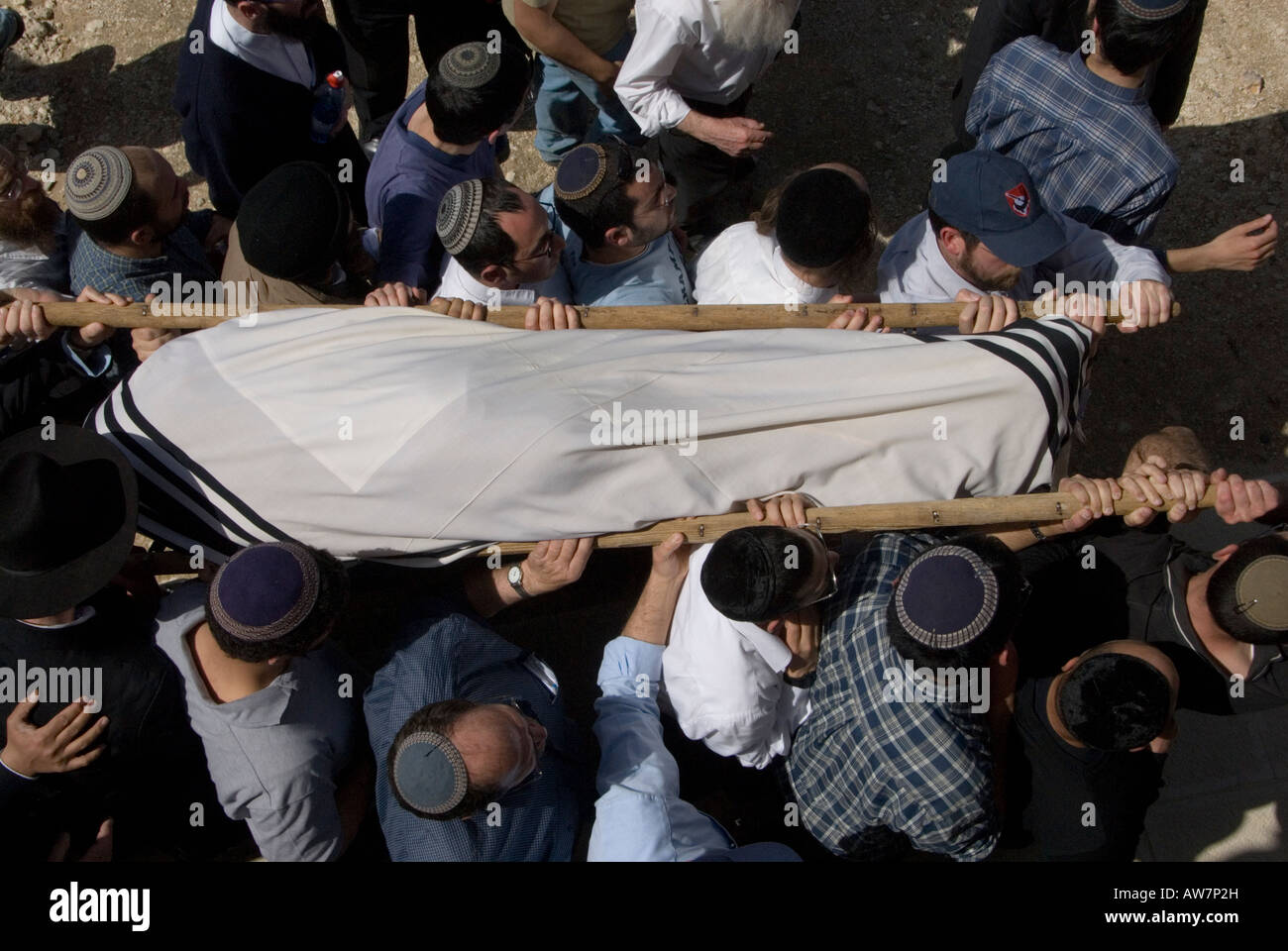 Orthodox Jews carrying shroud-covered body in a Jewish funeral, Israel