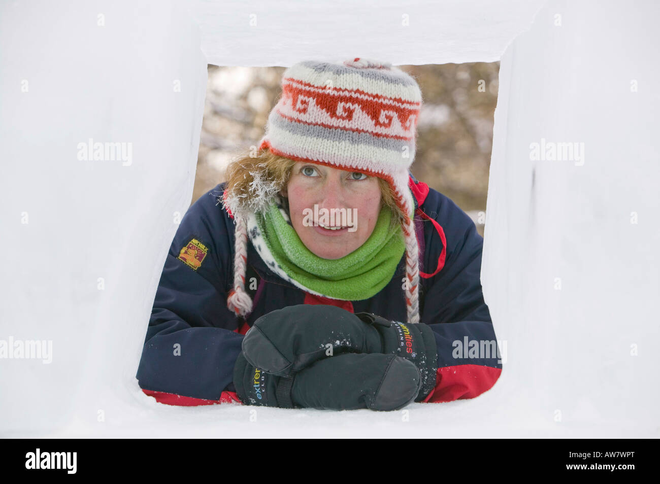 A woman surrounded by ice blocks near Saariselka Northern Finland Stock Photo