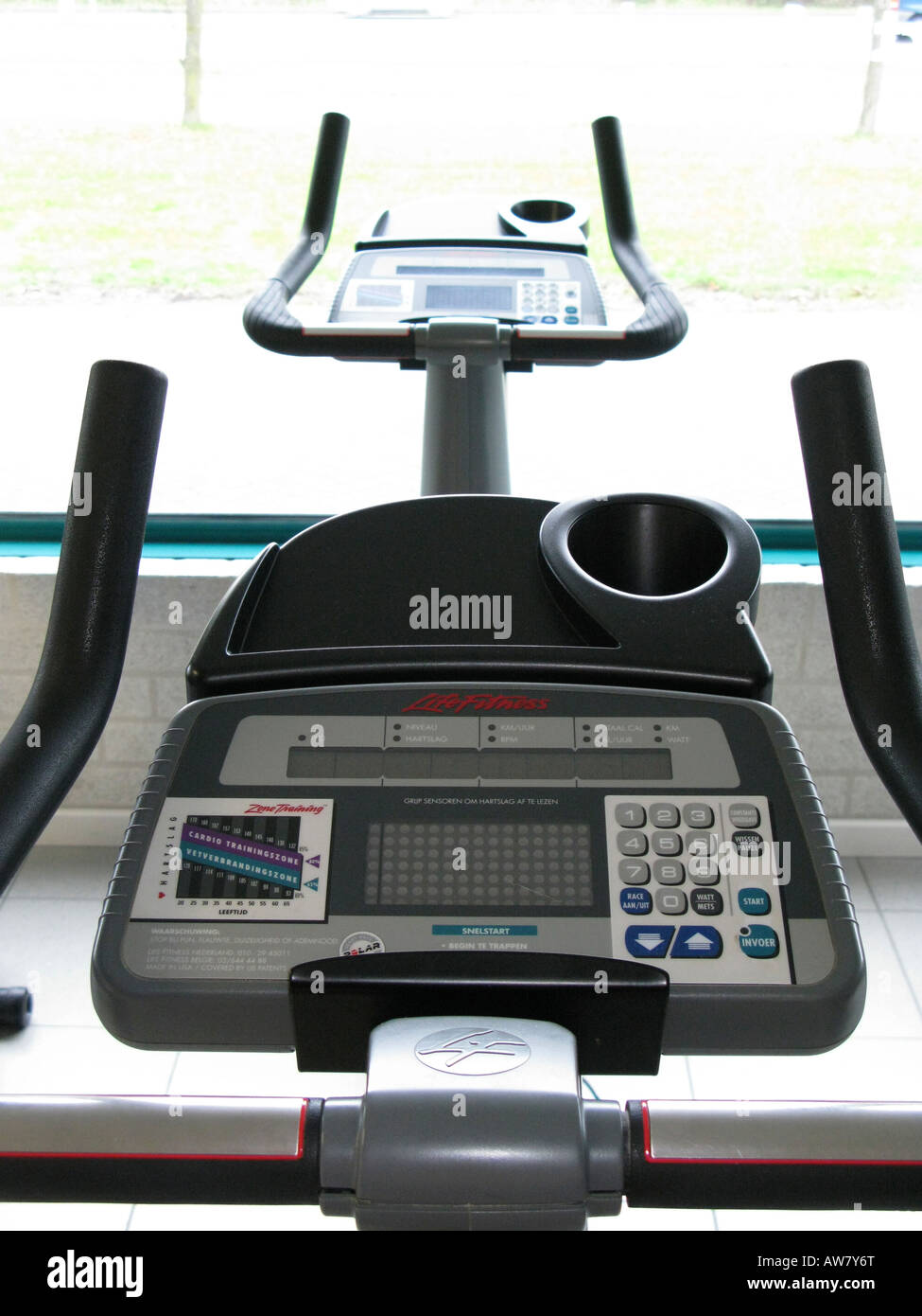 controls and dials on running machine in fitness club Stock Photo