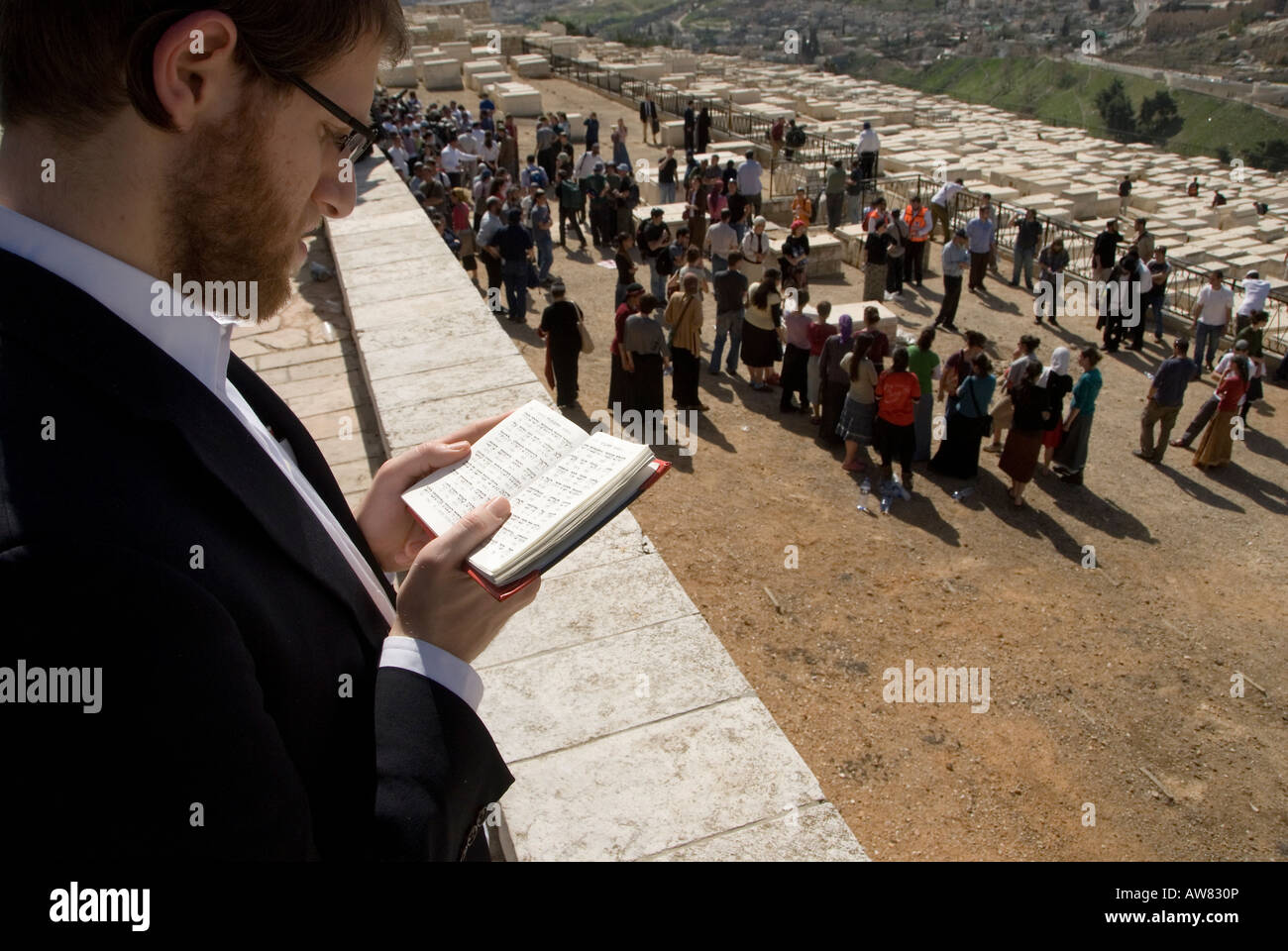 An ultra orthodox Jewish man praying at a Jewish funeral at the Mount