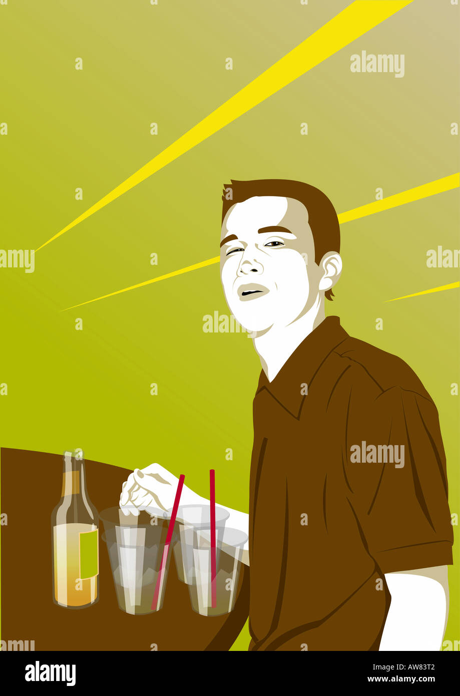 Young man standing at the bar with drinks Stock Photo
