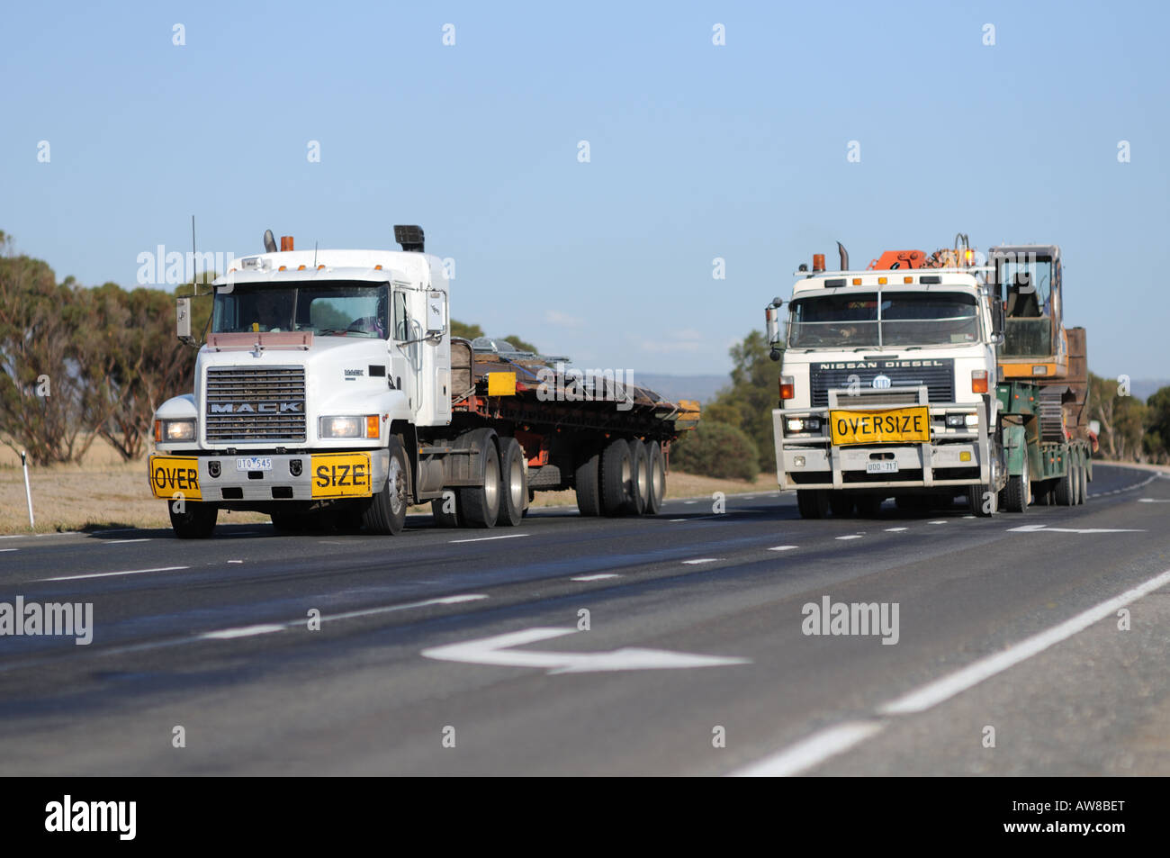 A Mack and UD Nissan hauling oversize loads on Port Wakefield Road