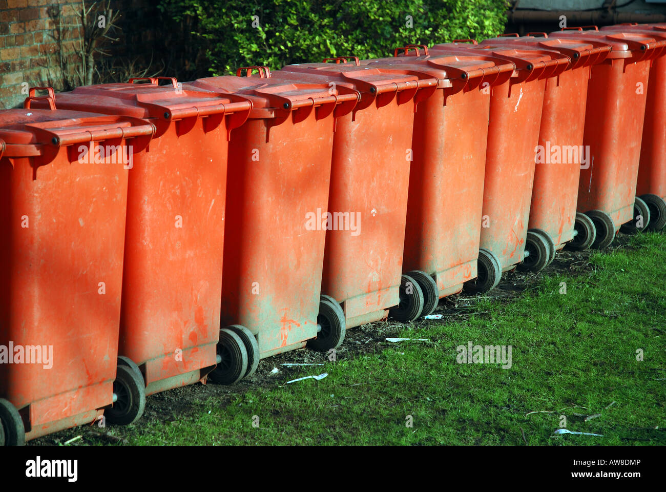 Red waste bins in a row Stock Photo Alamy