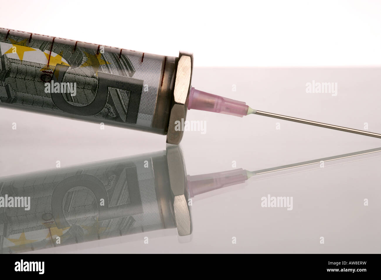 "Syringe containing bank note" Stock Photo