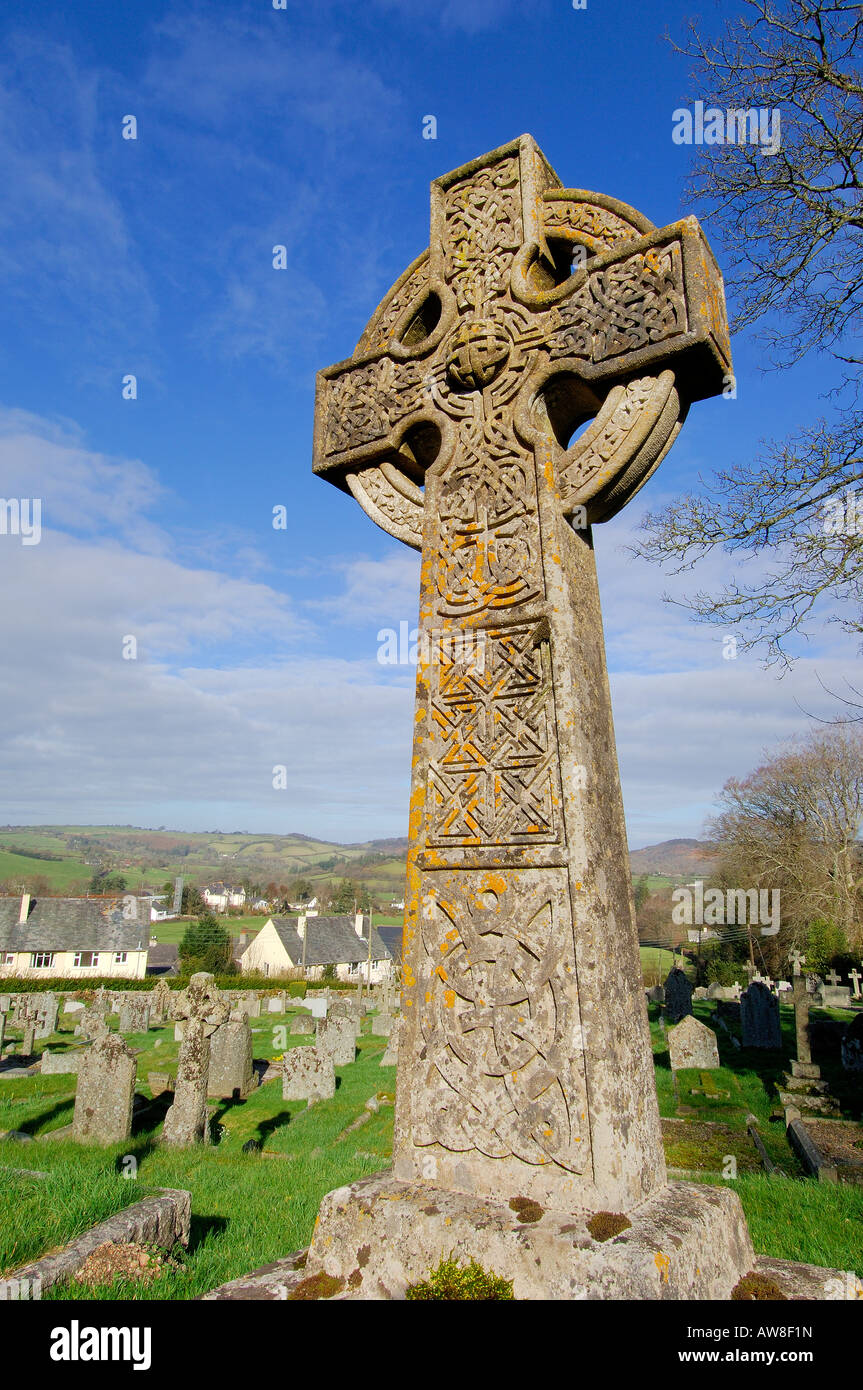 Stone cross with a celtic design in the graveyard of St Michael the Archangel church at Chagford on Dartmoor Stock Photo