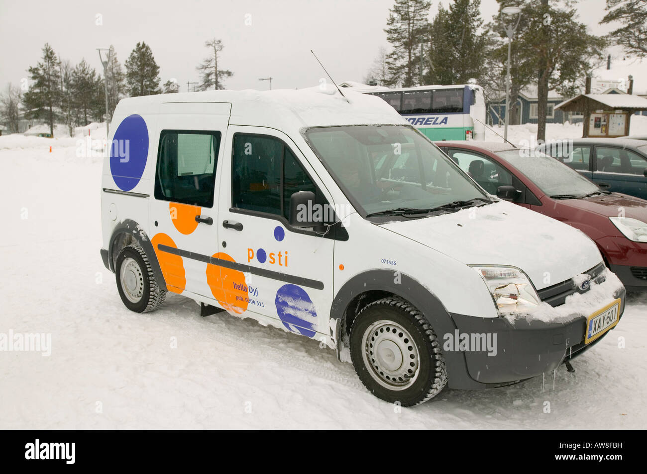 A postal van outside a hotel in northern Finland Stock Photo