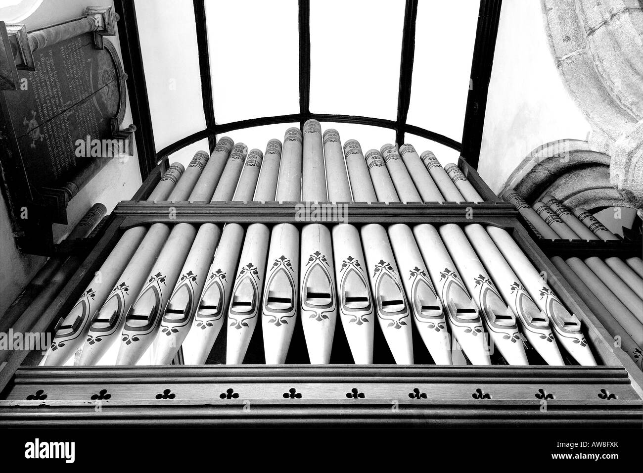 Decorative organ pipes in St James Church at Christow on Dartmoor South Devon from below in monochrome Stock Photo