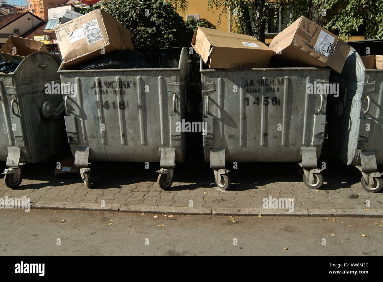 Rubbish Bins on a City Street Stock Photo - Alamy