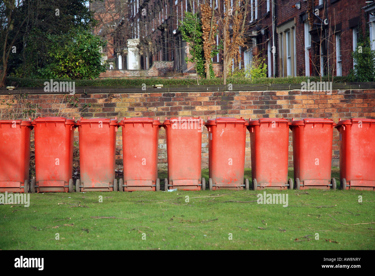 Red waste bins in a row Stock Photo Alamy