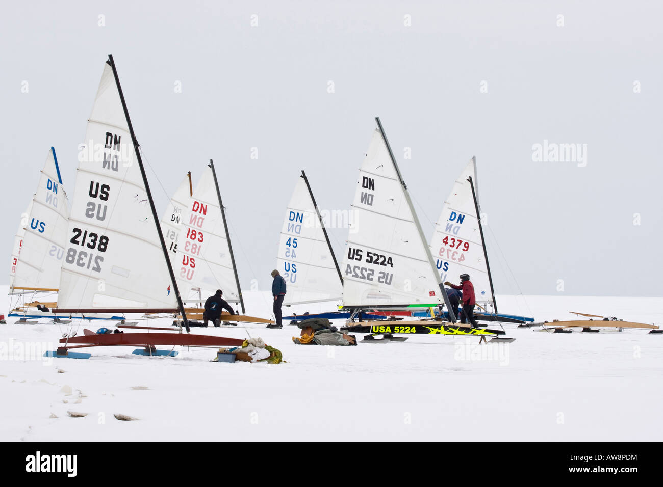 Ice boats on frozen Lake Erie in Toledo Ohio USA winter sport sports day snow action group people race racers Stock Photo
