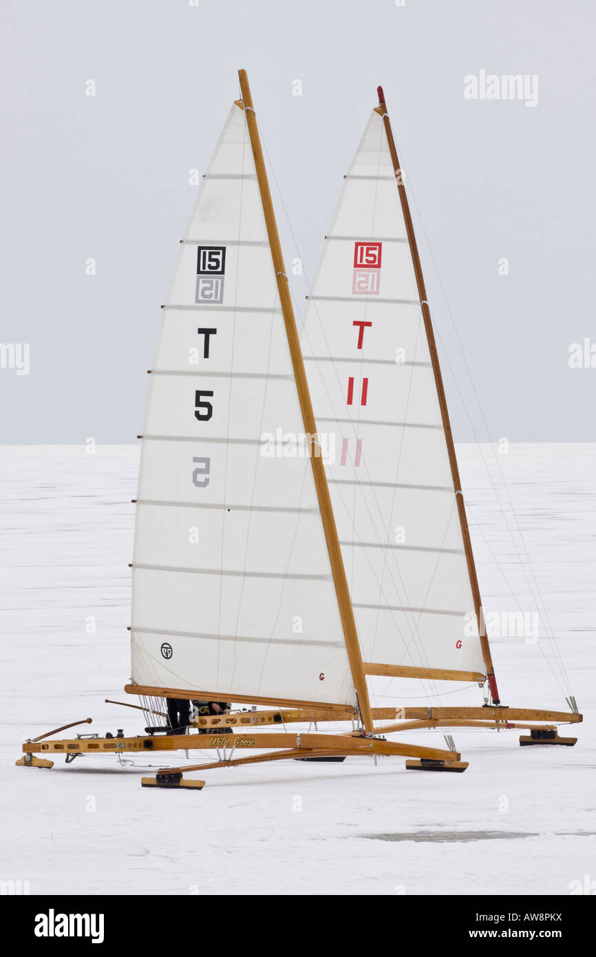 Ice boats on frozen Lake Erie in Toledo Ohio winter sport sports day snow race racing yachting boating images pictures USA US vertical format hi-res Stock Photo