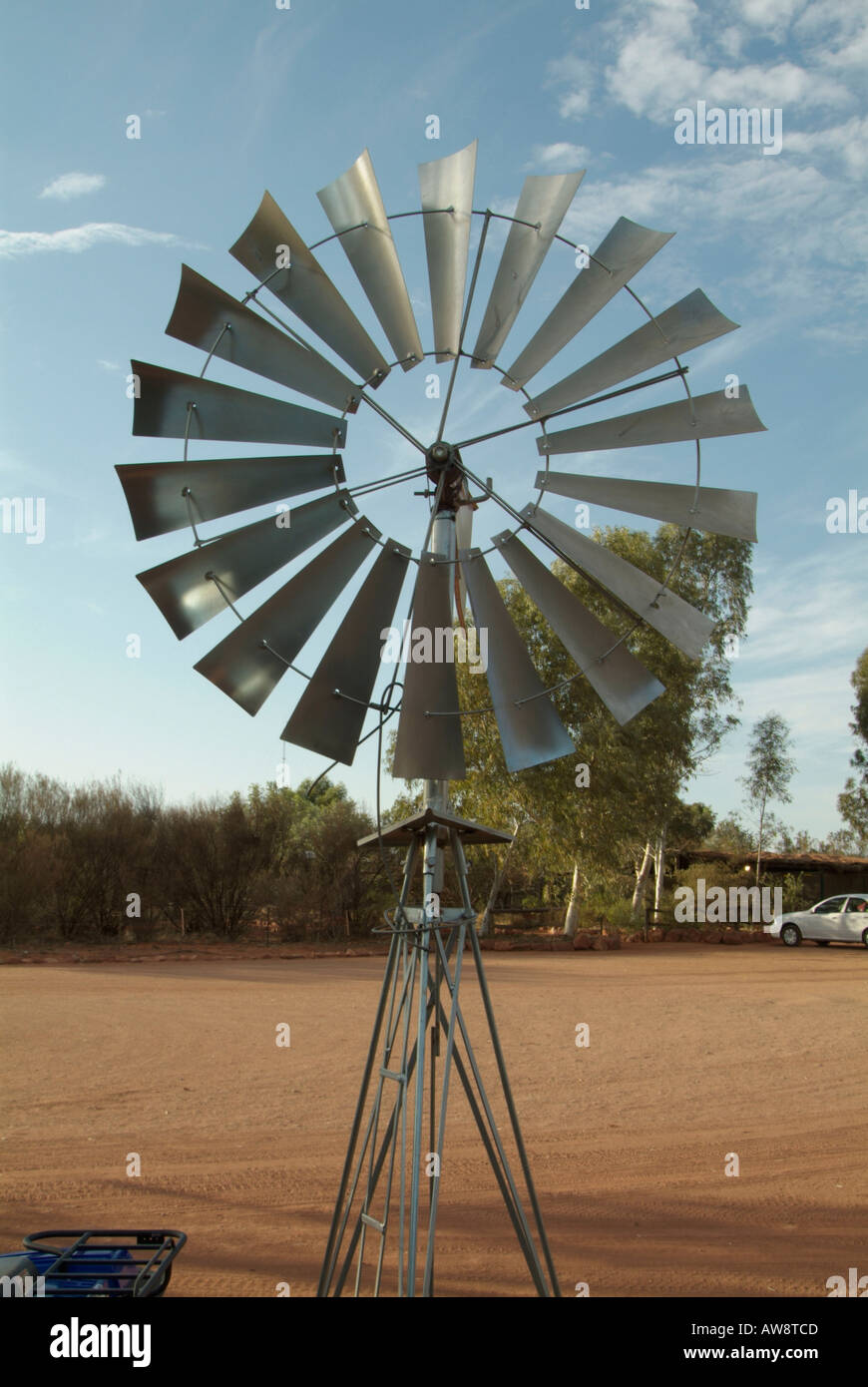 windmill wind powered power energy water pump turn spin Australia Stock