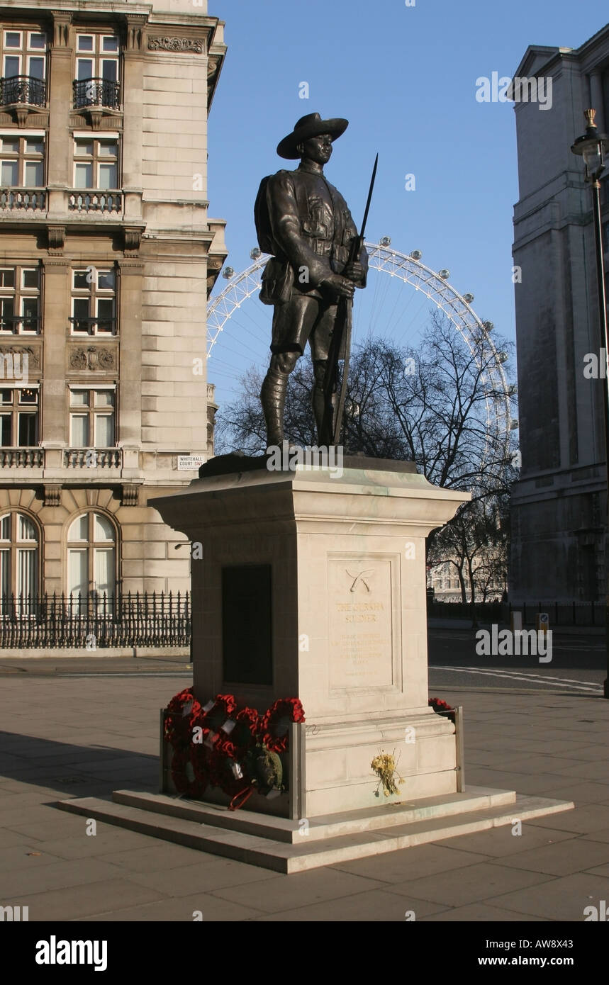 The Gurkha Soldier Memorial in afternoon sunlight and London Eye behind - Horse Guards Avenue, London England UK Stock Photo