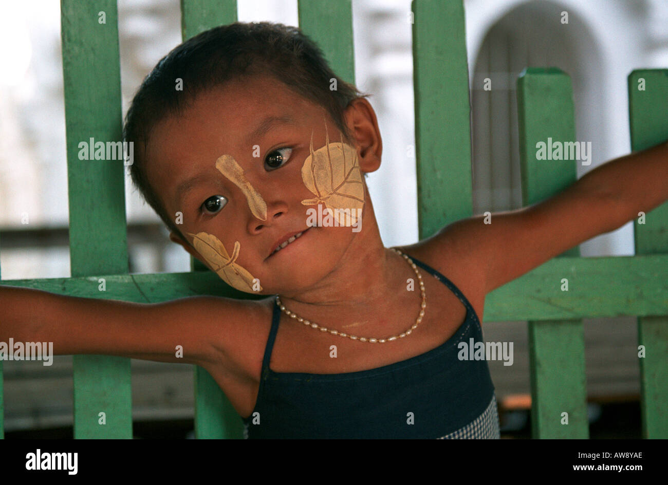 Girl with 'thanakha' on her face,  Mandalay, Myanmar (Burma) Stock Photo