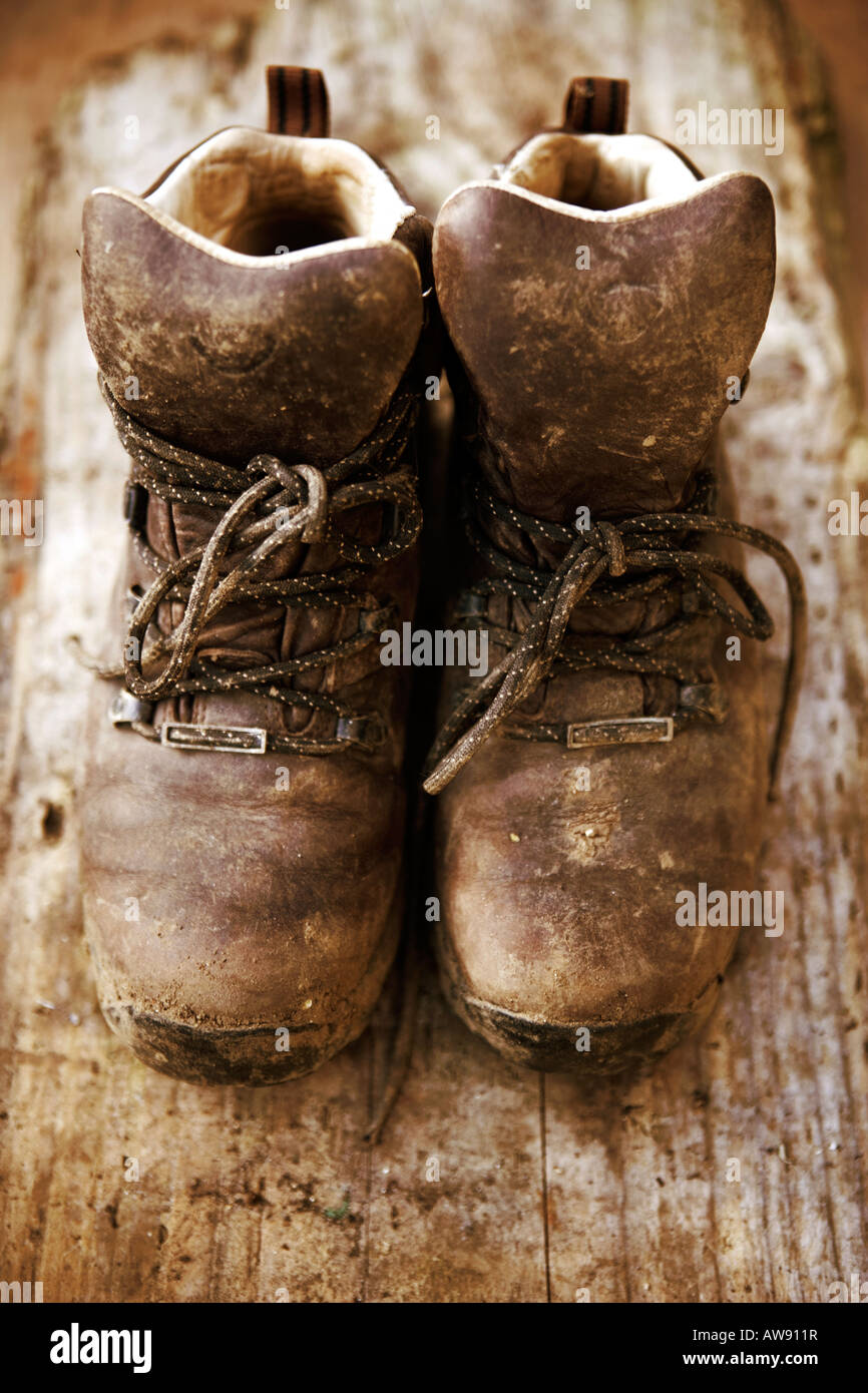 Aged, worn and battered walking boots Stock Photo