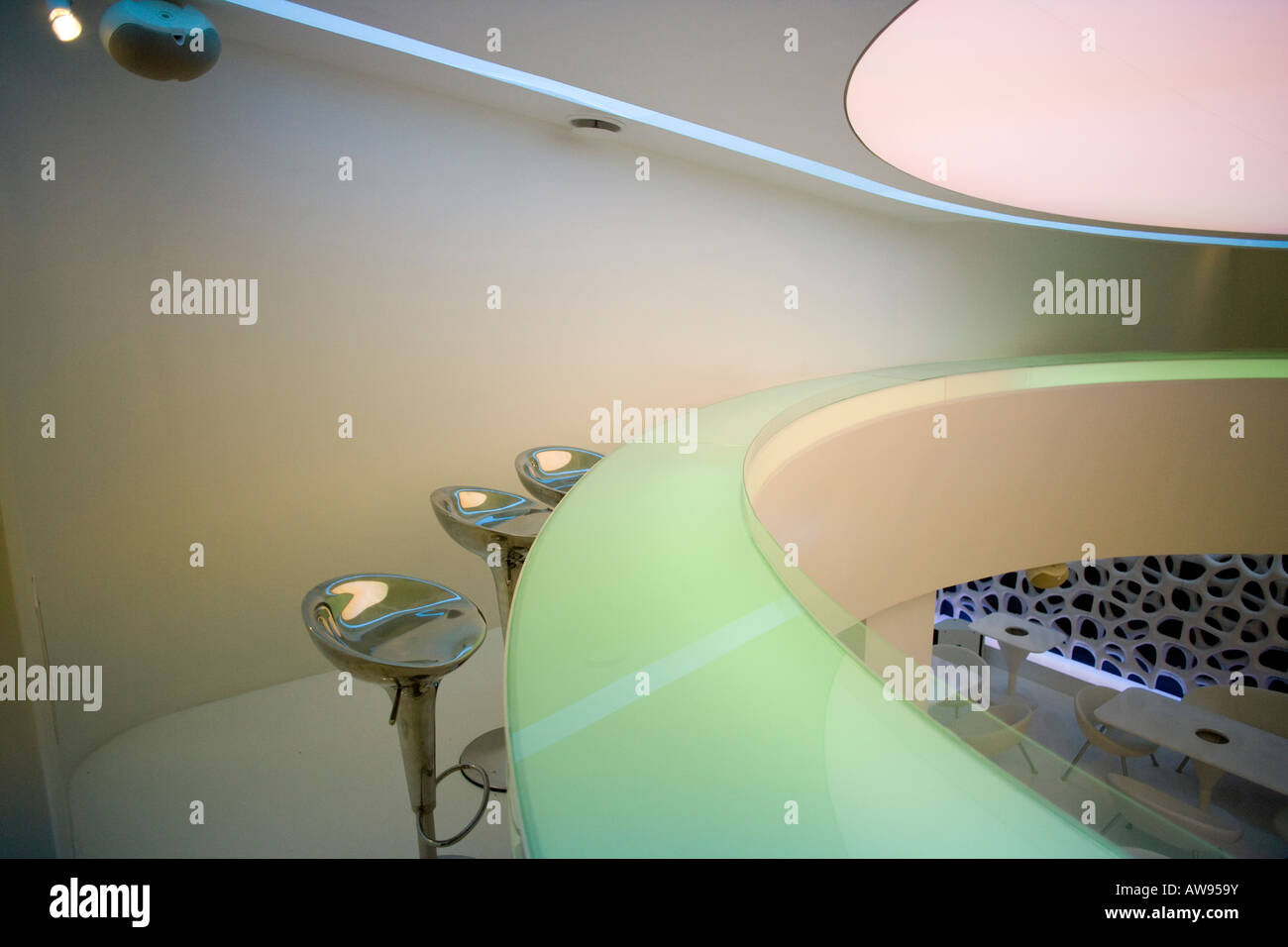 the interior of a modern bar with three metal stools Stock Photo - Alamy