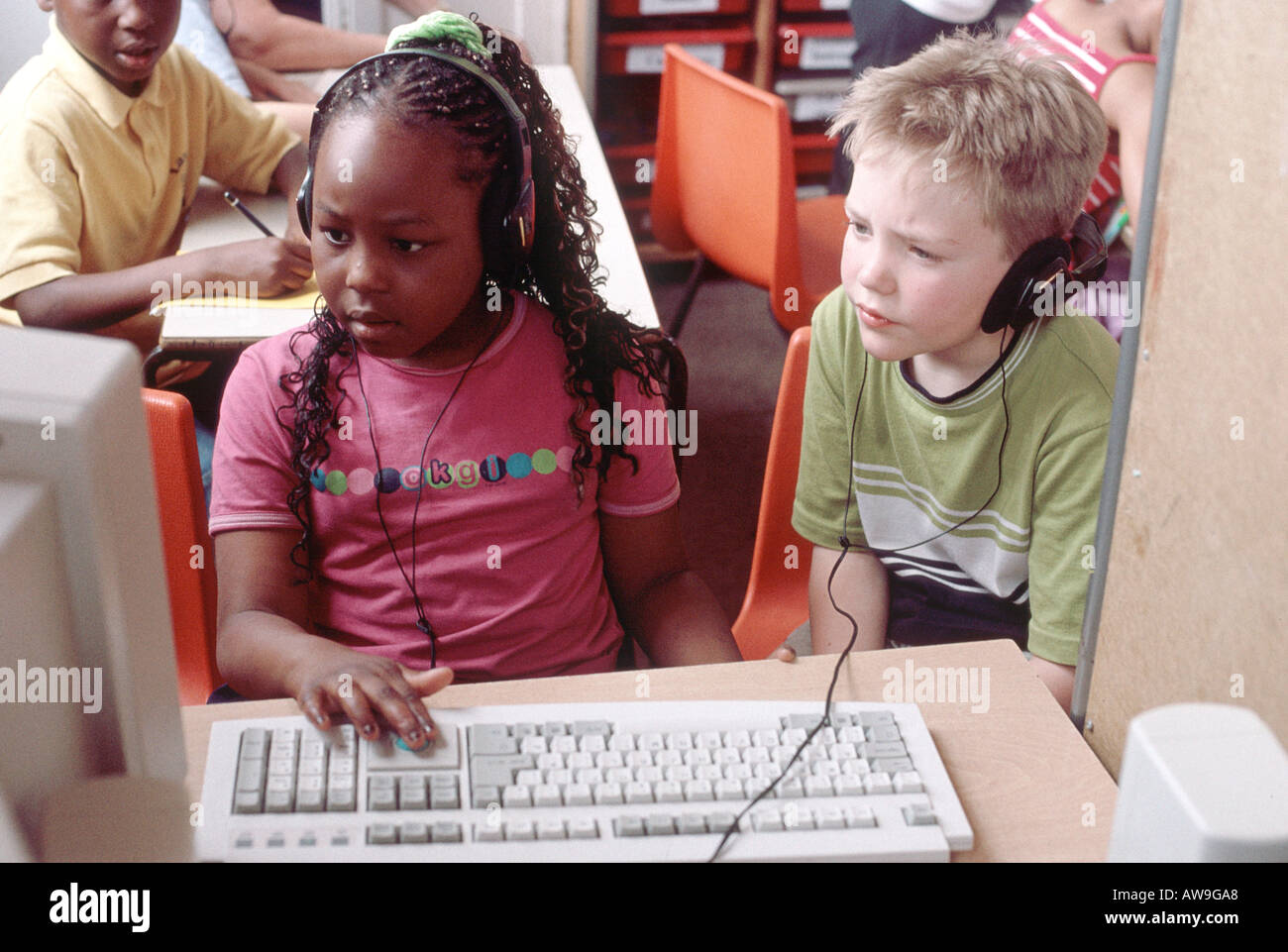 Primary school children in a computer classs Stock Photo - Alamy