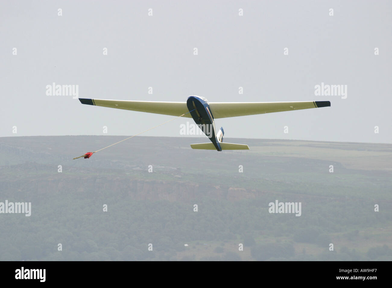 A vintage glider being launched by winch over Derbyshire Stock Photo