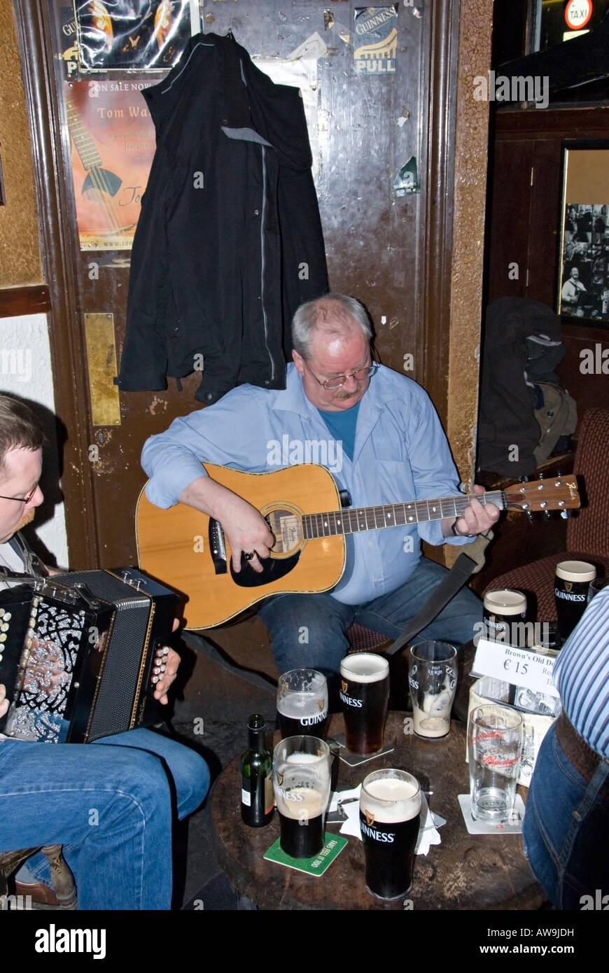 Musicians play traditional Irish folk music in a Dublin bar. Stock Photo