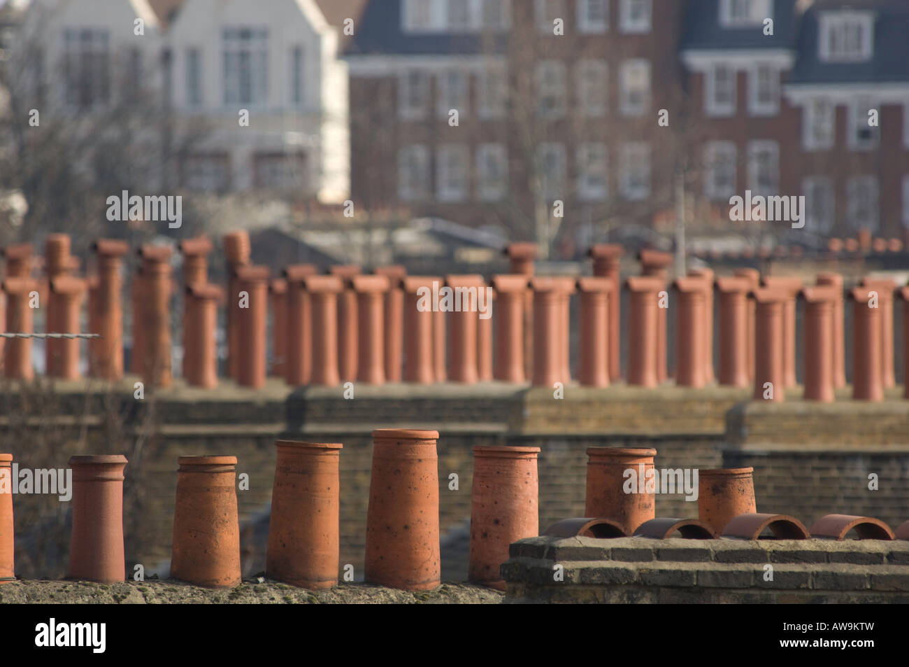 Chimney pots displaying a rooftop cityscape of aLondon past. Stock Photo