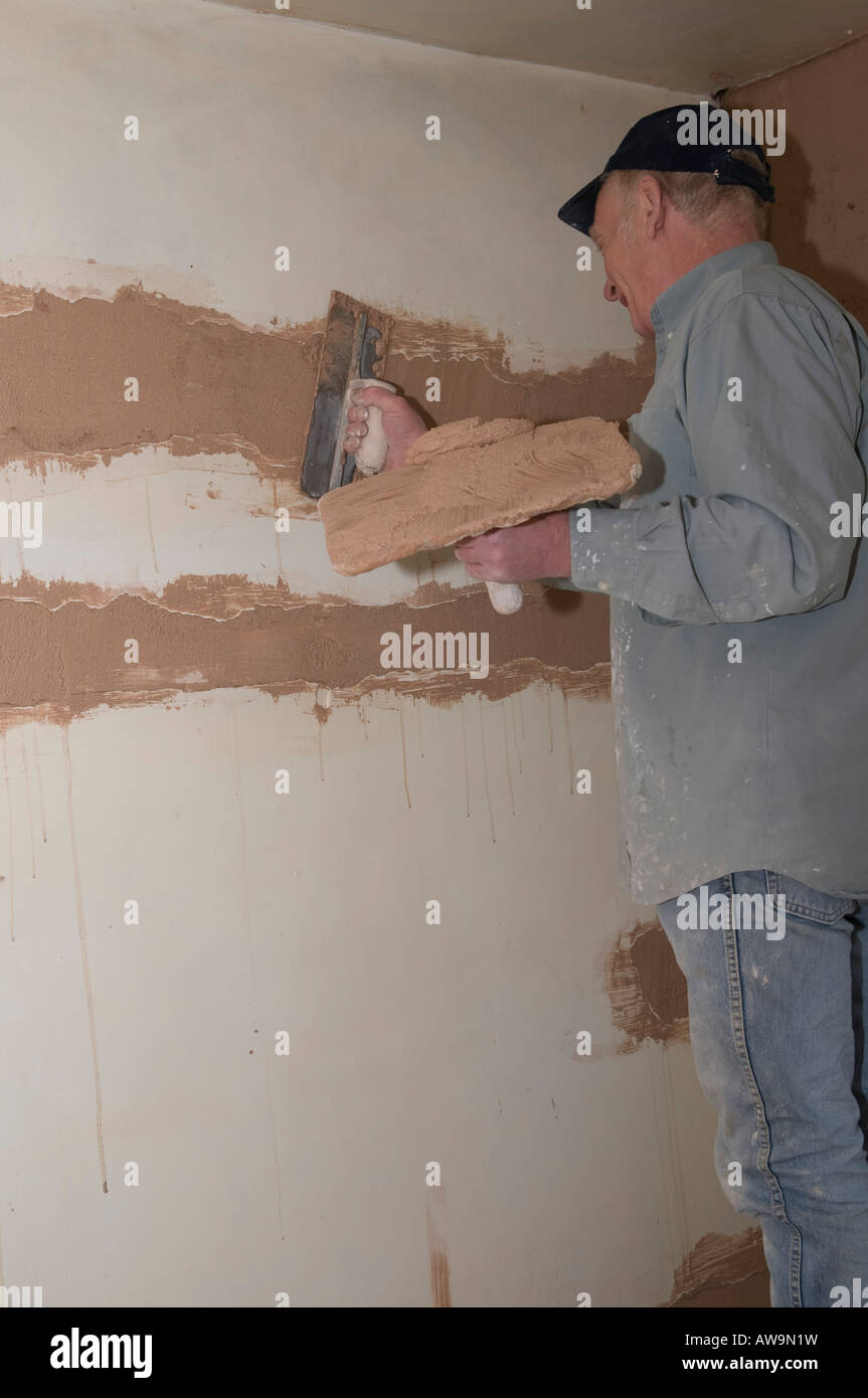 Plastering old wall Stock Photo - Alamy