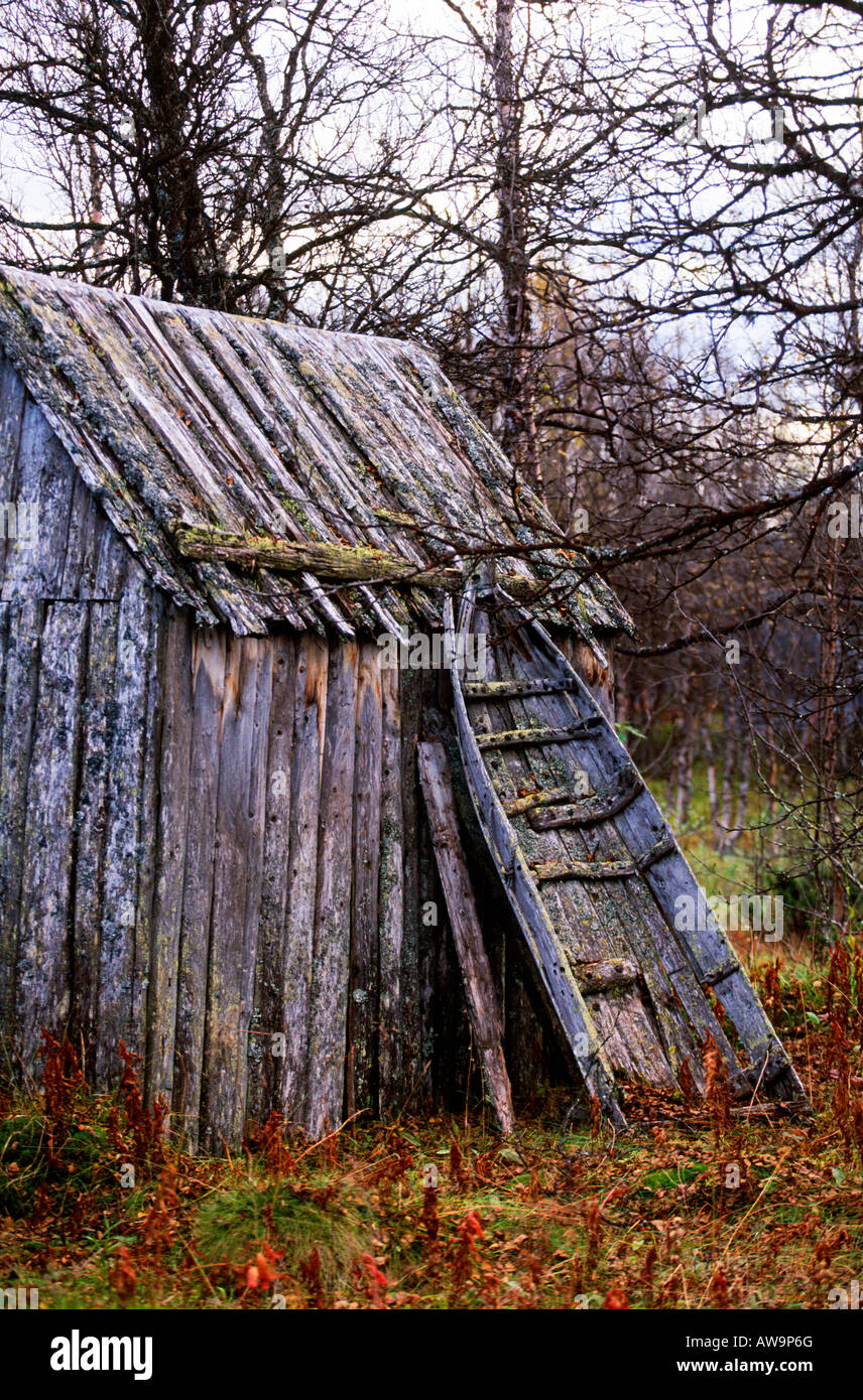 Old lappish sledge lean on the wall Stock Photo