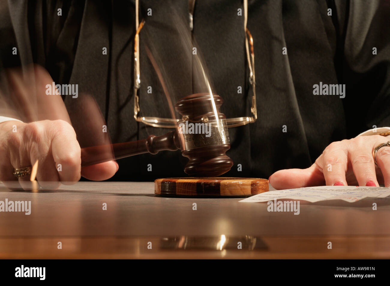 Judge using a gavel Stock Photo Alamy