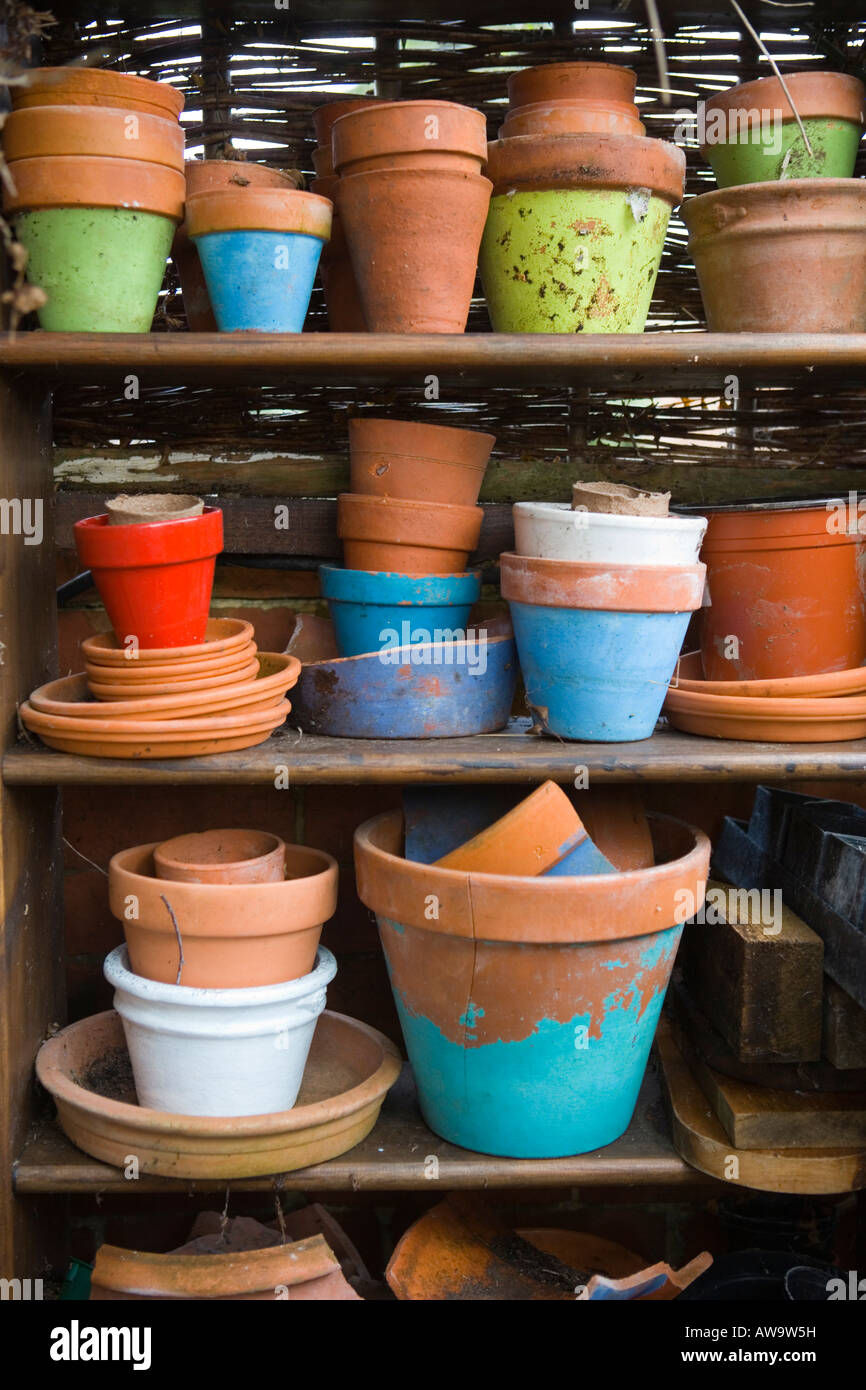 Terracotta pots stacked up on a shelf Stock Photo
