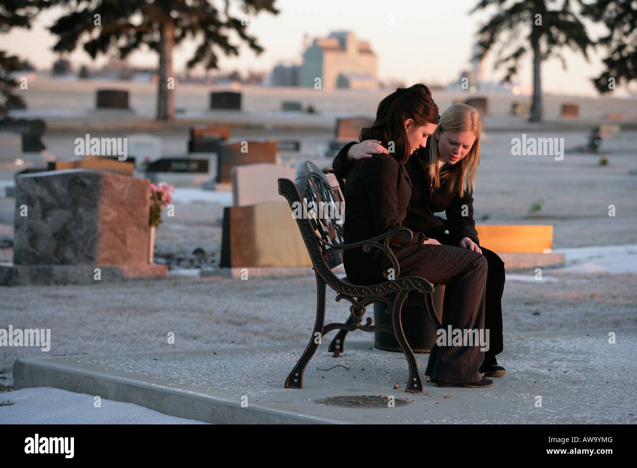 Two women praying together Stock Photo