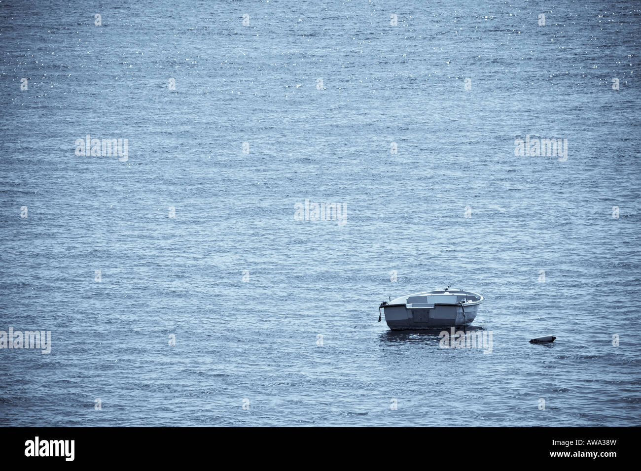 Lone fishing boat sea waves hi-res stock photography and images - Alamy