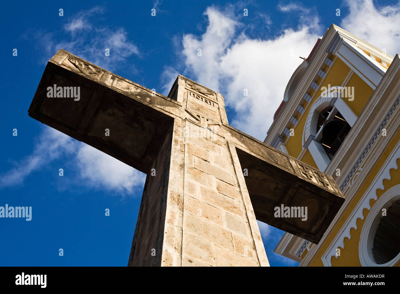 The cross and the church in Grenada, Nicaragua. Stock Photo