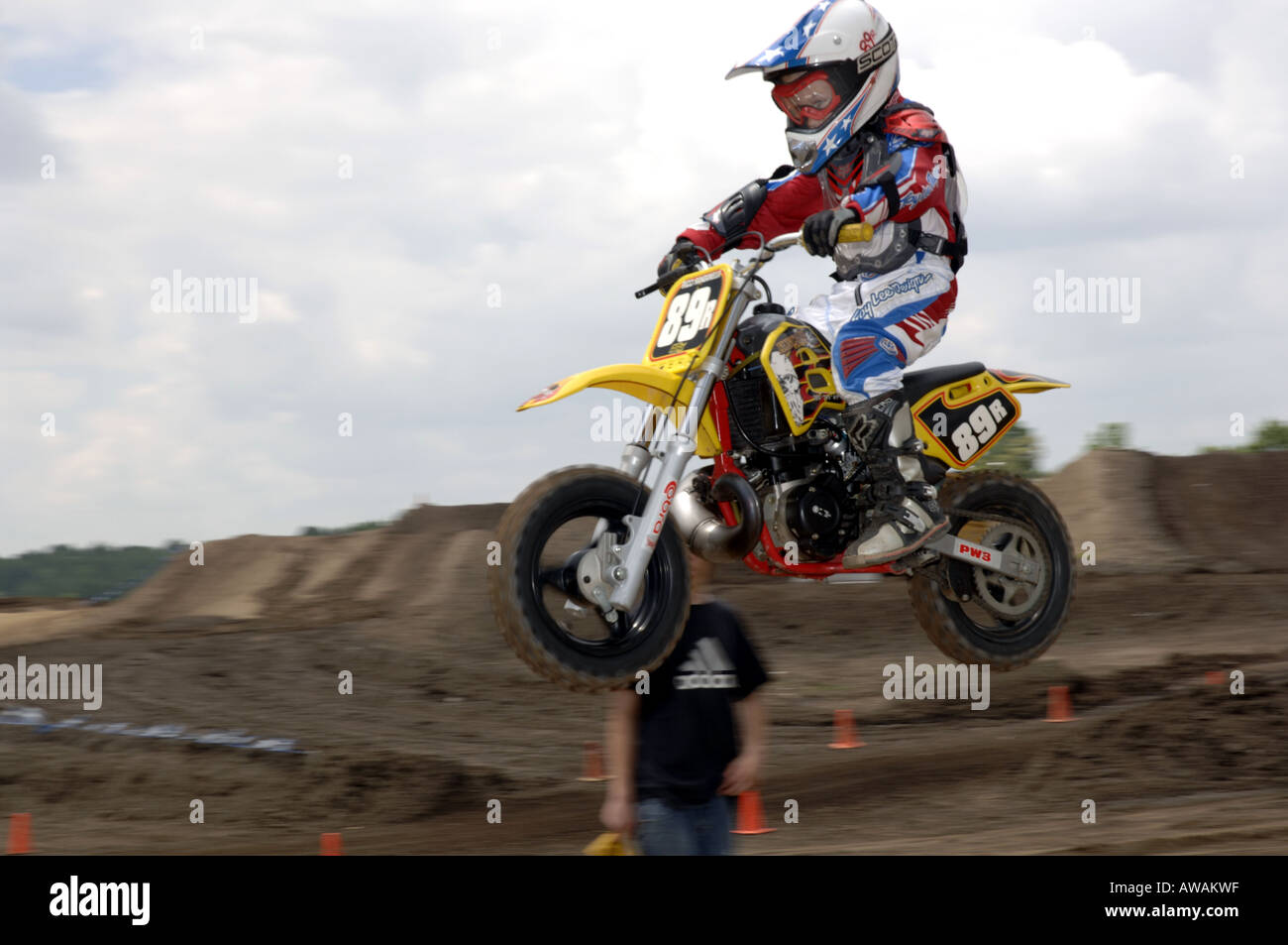 6 year old races on a Honda 50 cc motorcyle in motocross race Stock Photo