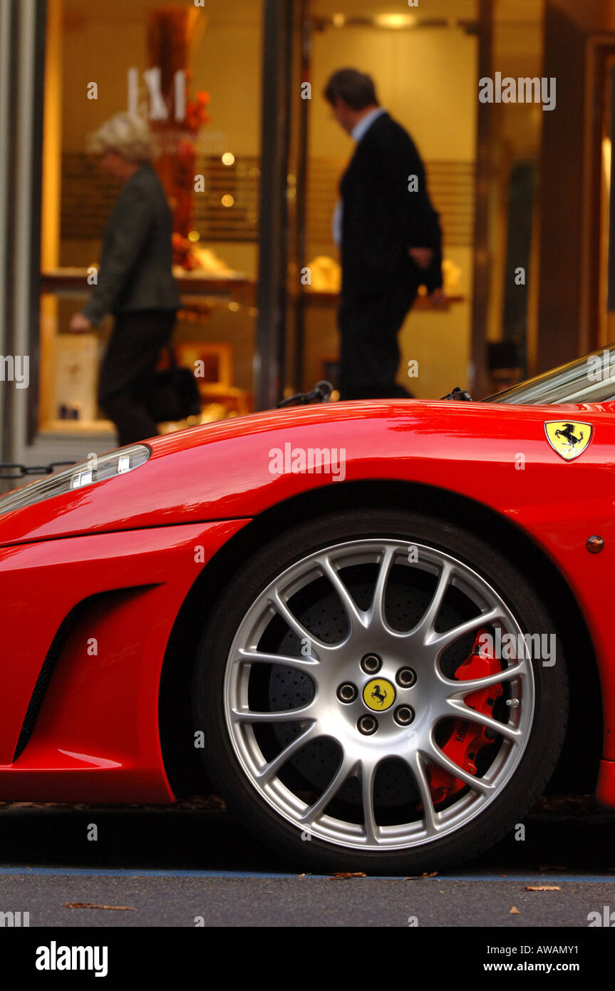 Ferrari in front of jewelery shop on Koenigsallee. Stock Photo